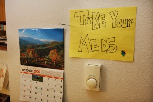 Bianca Lewis has several signs at her Sun Prairie, Wis. apartment, Saturday, October 17, 2009 reminding her to take her medications and to give her children theirs.
