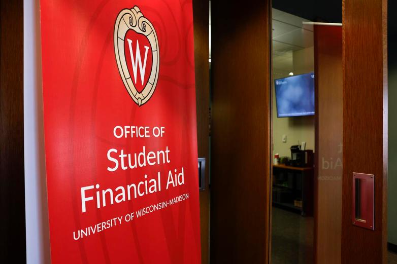 “Office of Student Financial Aid University of Wisconsin-Madison” sign next to a door to another room